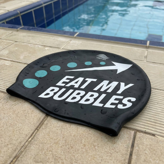 Eat My Bubbles silicone swim cap by Cutwave - black with bold wave-drop graphic